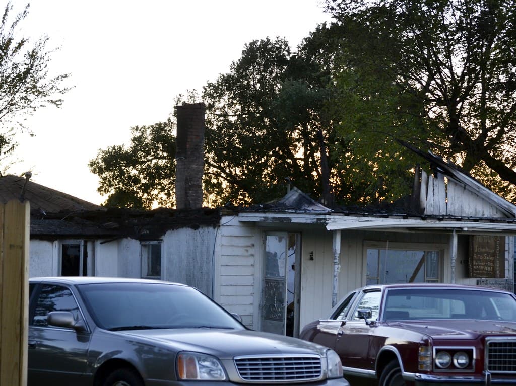 Fire-damaged house exterior after blaze
